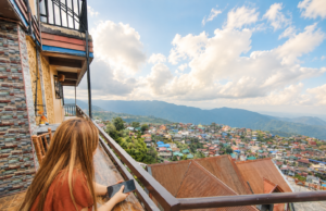 woman-looking-out-the-view-of-Baguio-City-Philippines.